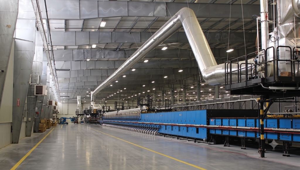 Interior view of Pixel Ceramic automated kiln and production line in Morbi, India